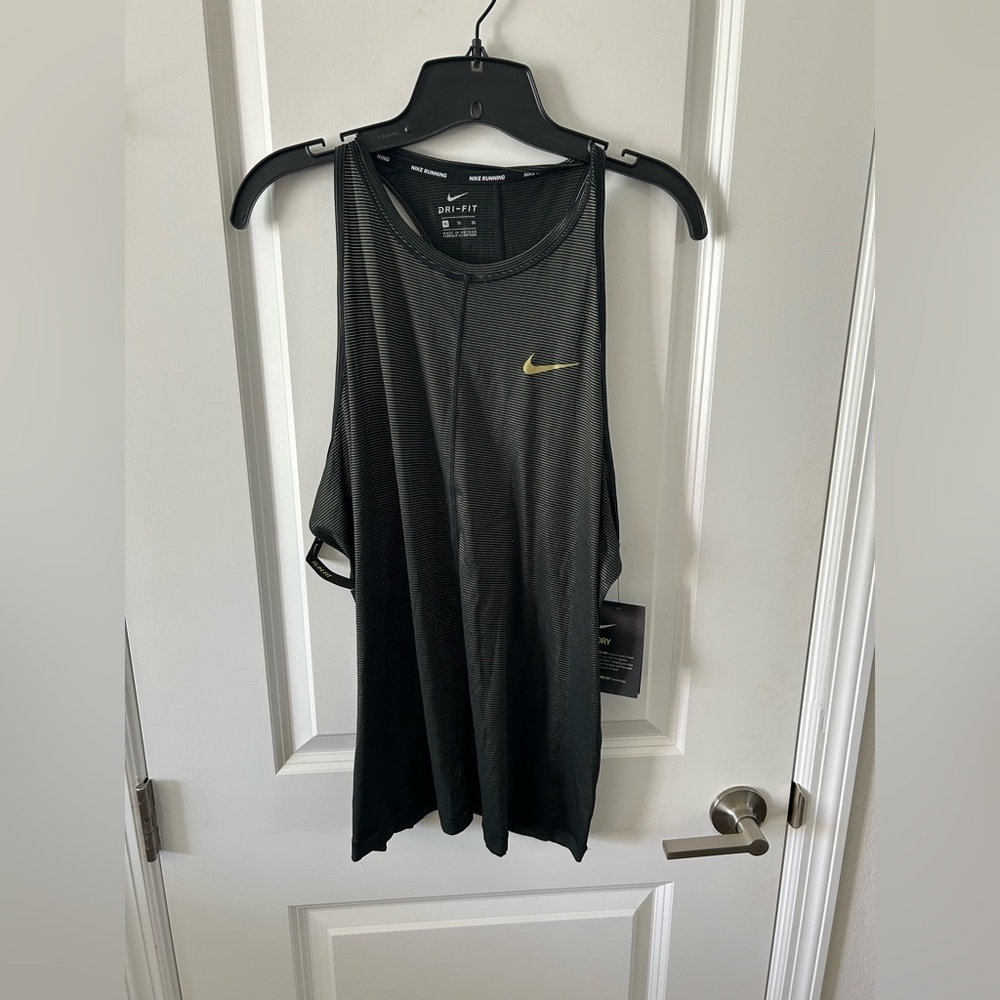 Nike Women's Black and Gold Tank Top